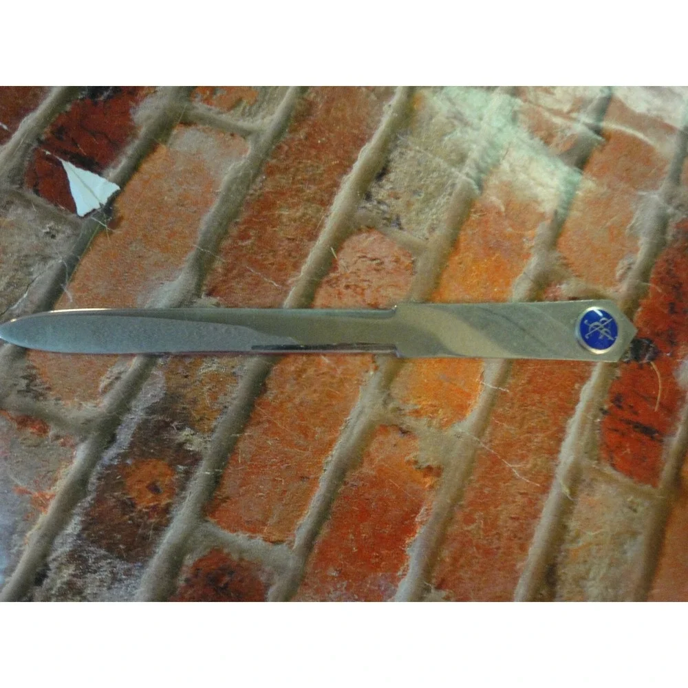 Italy stamped letter opener with CCC and golf clubs symbol estate find